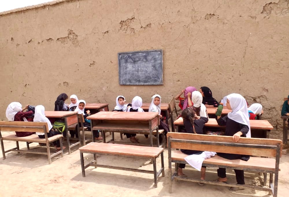 Learning Under the Open Sky: Afghan Children Study Outdoors Despite Severe Classroom Shortage