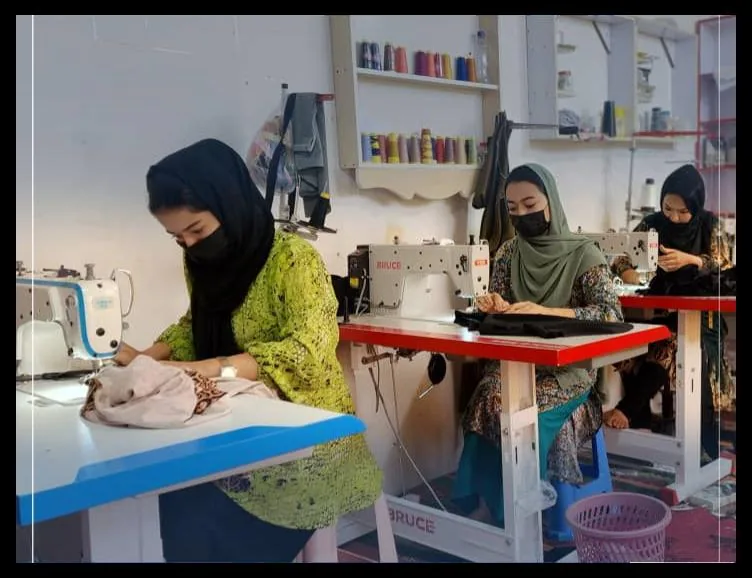 Afghan women working in a Gate of Hope-supported tailoring workshop
