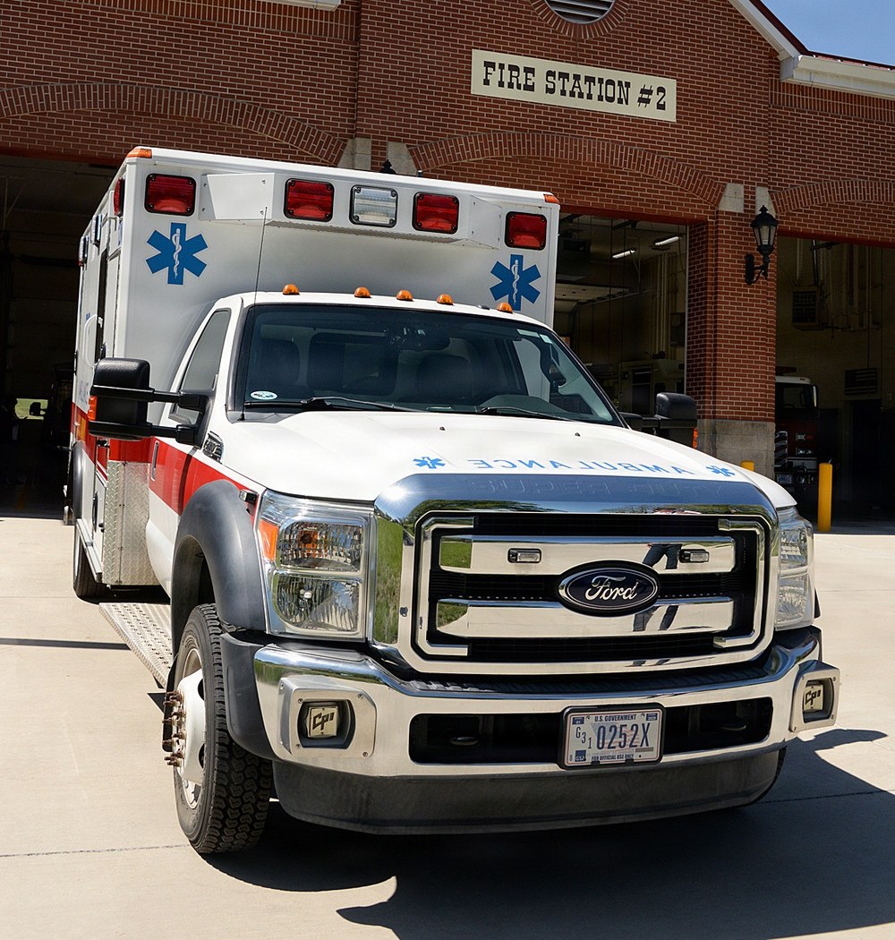 A white emergency ambulance parked outside Fire Station 2 at Fort Leavenworth, Kansas.